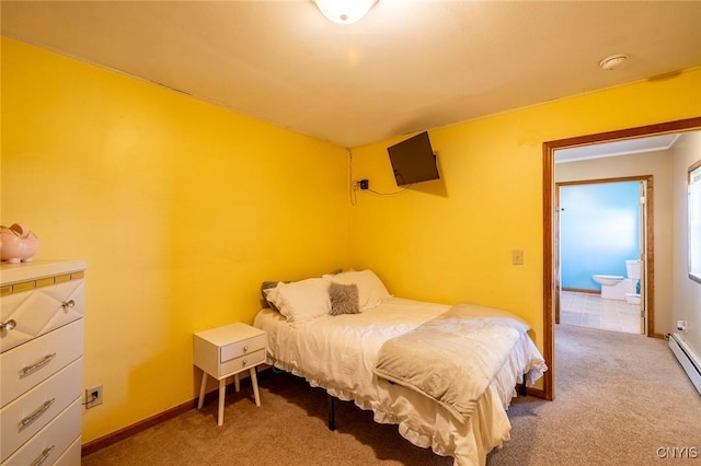 bedroom with baseboards and carpet floors