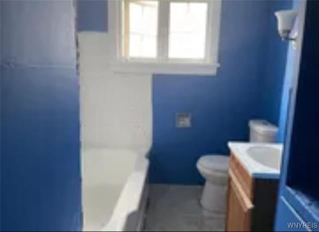 bathroom featuring vanity, a bathtub, a shower, and toilet