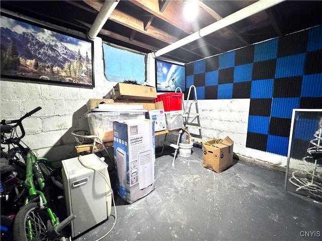 misc room with unfinished concrete floors