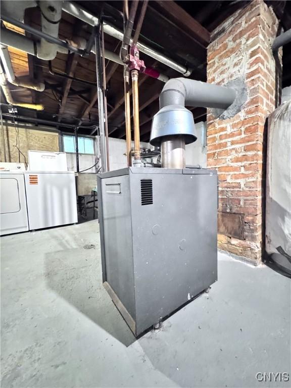 utility room with independent washer and dryer