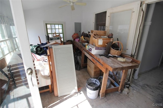 interior space featuring lofted ceiling, electric panel, and ceiling fan