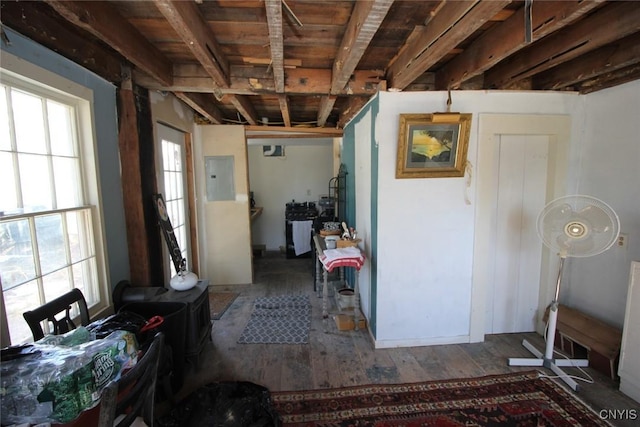 miscellaneous room with electric panel and wood finished floors