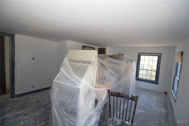interior space featuring baseboards