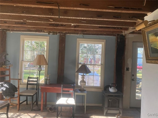 5081 Military Rd, Russia, NY 13431 - interior space with a healthy amount of sunlight and a wood stove