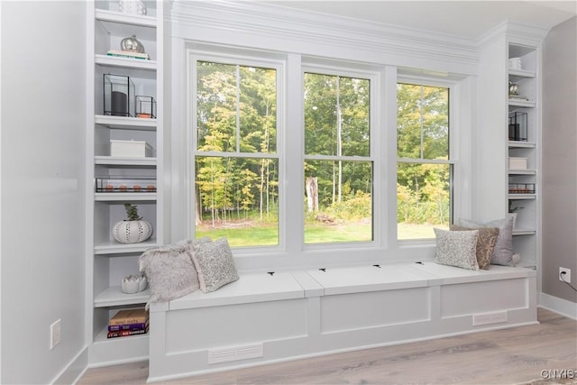 1M Longview Ter, Lysander, NY 13027 - sitting room with wood finished floors, ornamental molding, and built in shelves