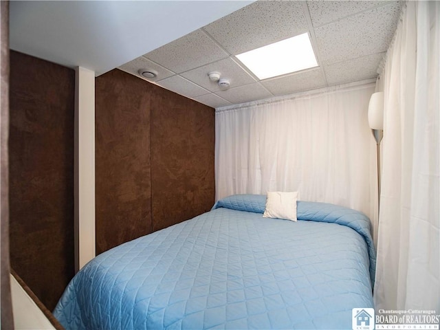 bedroom with a drop ceiling