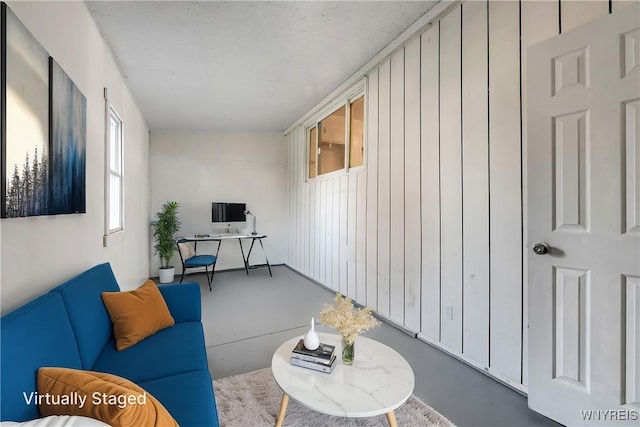 living room featuring finished concrete flooring