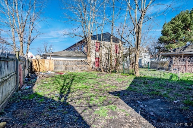 view of yard with a fenced backyard