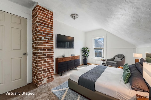 carpeted bedroom featuring vaulted ceiling