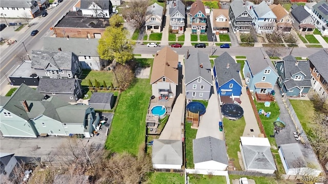 birds eye view of property with a residential view