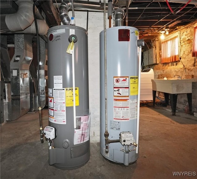 utilities featuring washer / clothes dryer, water heater, and electric panel