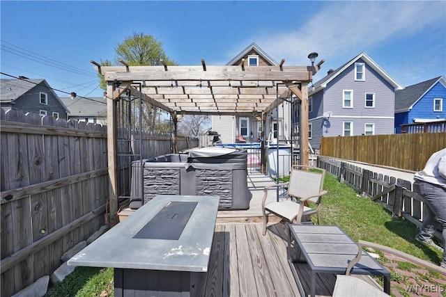 deck with a pergola and a fenced backyard