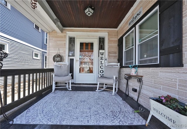 entrance to property featuring a porch