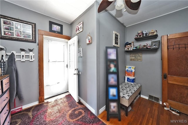 entrance foyer featuring baseboards, visible vents, wood finished floors, and a ceiling fan