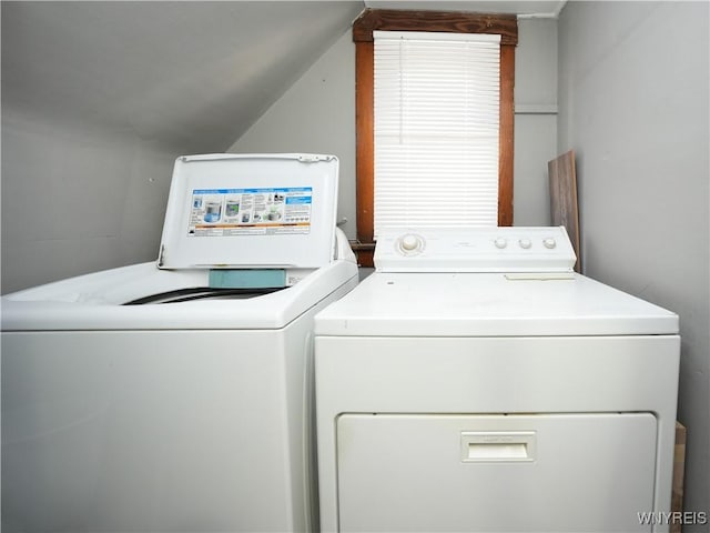 laundry room with separate washer and dryer and laundry area