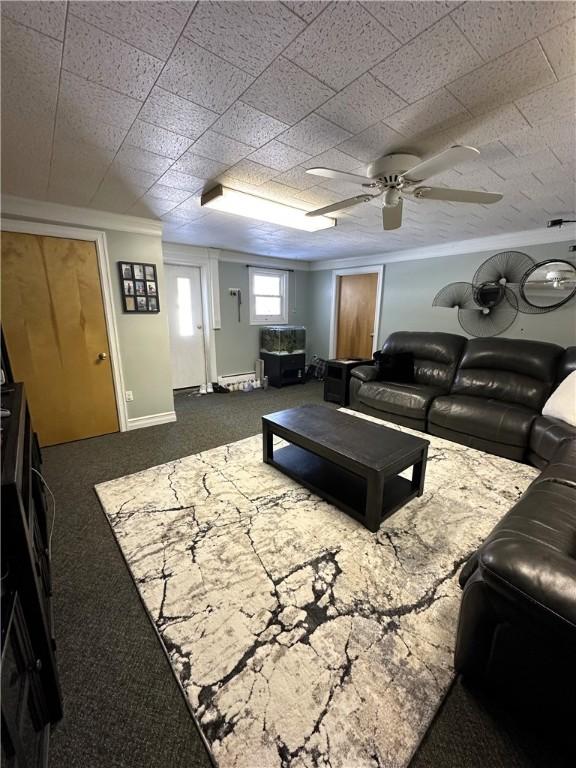 living area featuring ceiling fan and carpet floors