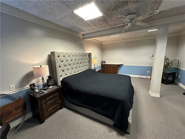 bedroom featuring crown molding, carpet flooring, and baseboards