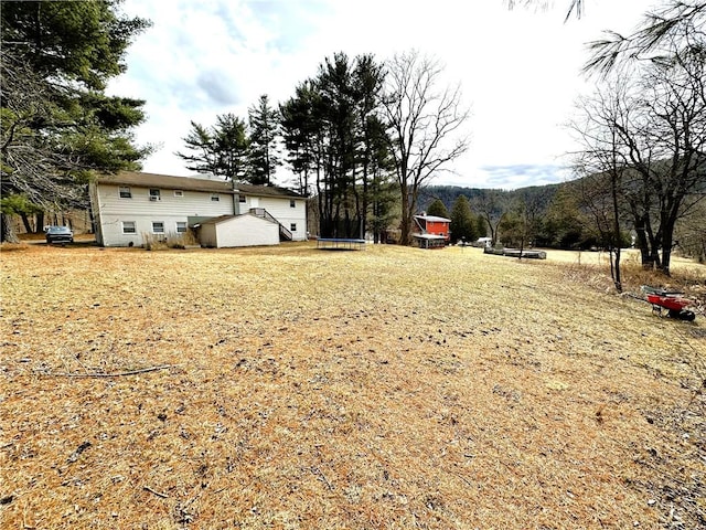 view of yard with a trampoline
