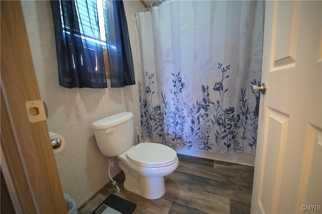 full bathroom with toilet and wood finished floors