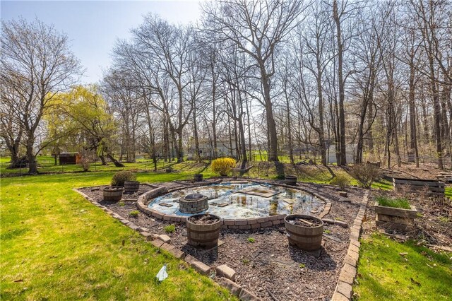 view of yard with an outdoor fire pit