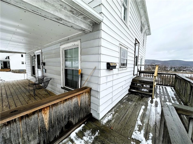 wooden deck featuring a mountain view
