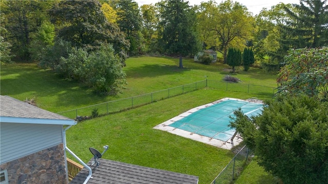 view of pool featuring a fenced backyard, a fenced in pool, and a lawn