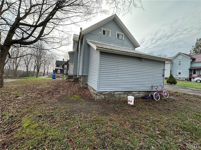 view of home's exterior with metal roof