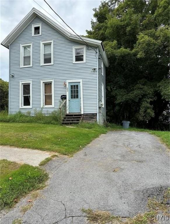 view of front of house with a front yard and entry steps