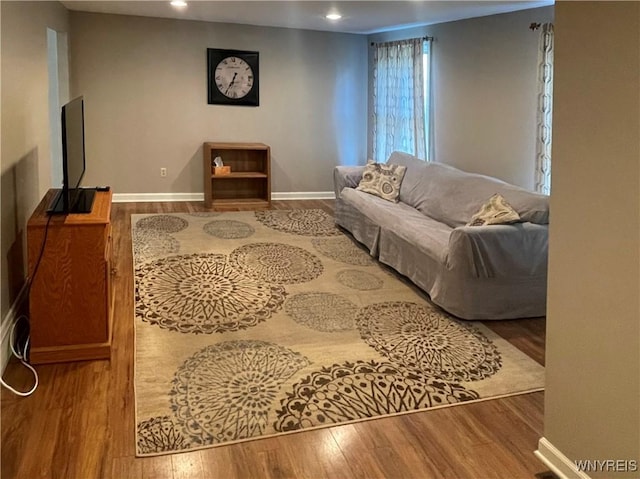 living room with recessed lighting, wood finished floors, and baseboards