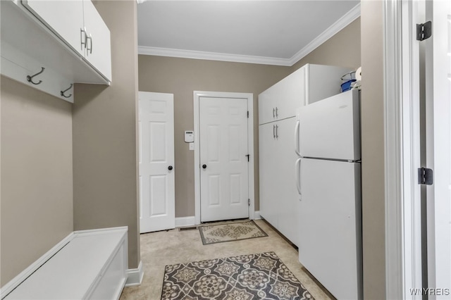 mudroom featuring crown molding and baseboards
