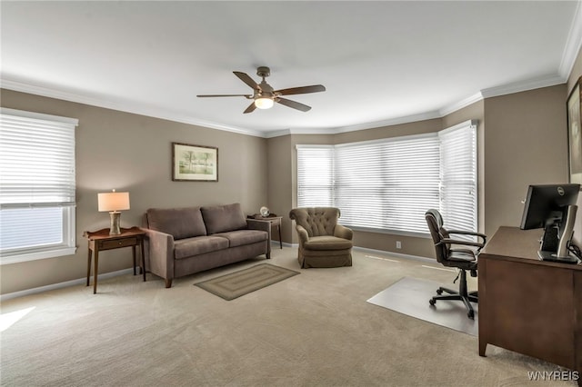 carpeted office space featuring baseboards, ornamental molding, and ceiling fan