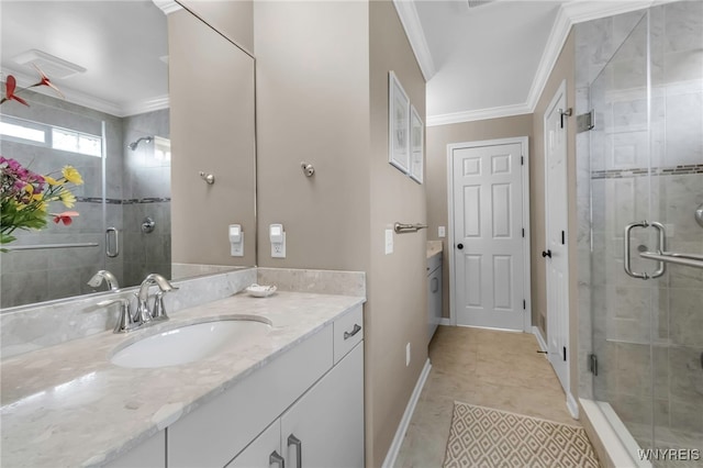 full bathroom with a stall shower, baseboards, ornamental molding, vanity, and tile patterned flooring