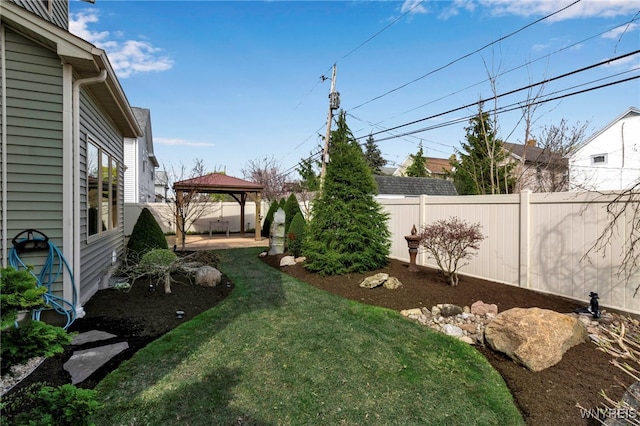 view of yard with a patio, a gazebo, and a fenced backyard