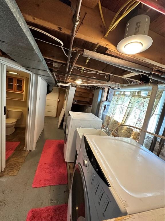 laundry area featuring washer and dryer and laundry area