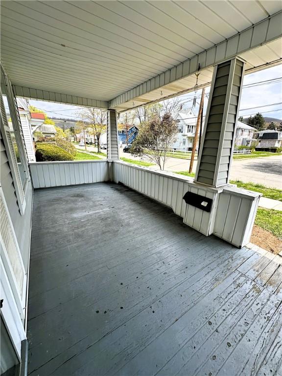 wooden deck featuring a residential view