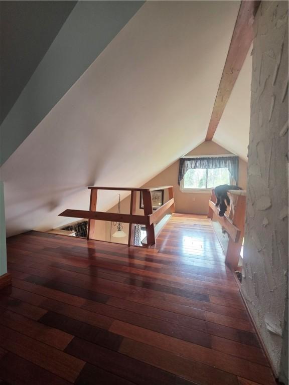 bonus room featuring hardwood / wood-style floors and lofted ceiling