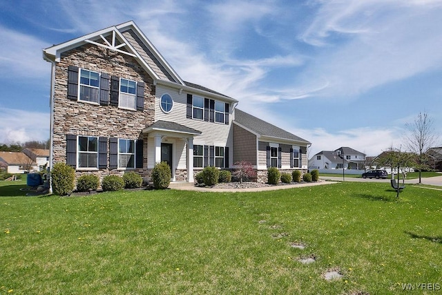 view of front of house featuring stone siding and a front lawn