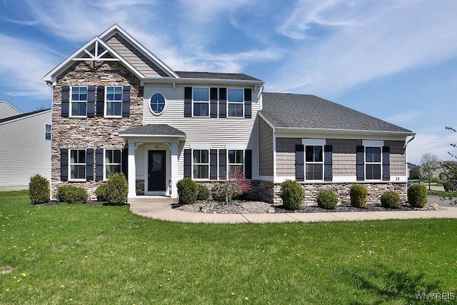 craftsman house featuring a front lawn, roof with shingles, and stone siding