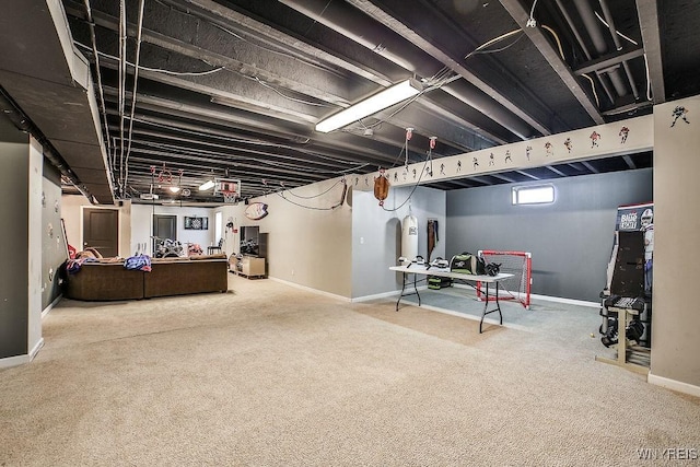 basement featuring baseboards and carpet