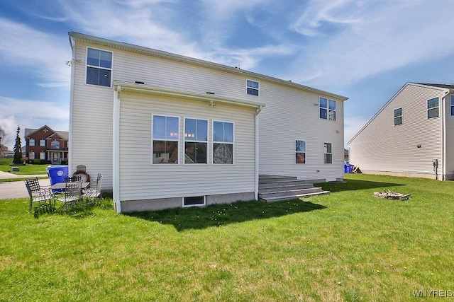 back of house featuring a yard