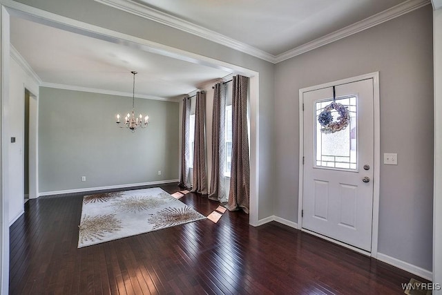 entryway featuring crown molding, baseboards, a chandelier, and dark wood-style floors