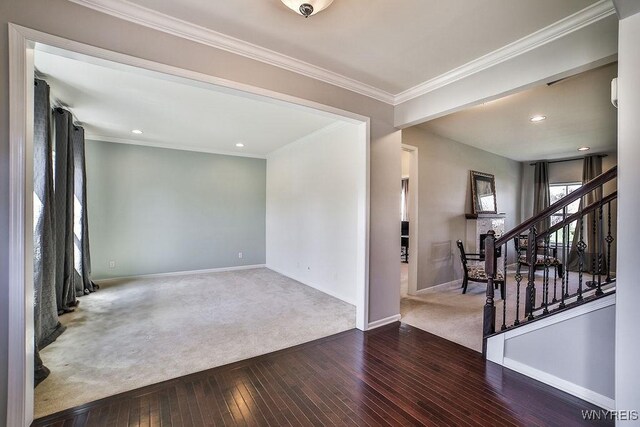 interior space featuring crown molding, wood-type flooring, stairs, recessed lighting, and baseboards