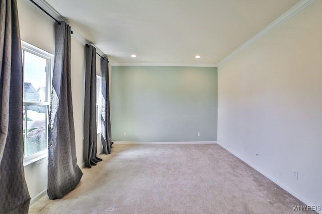 empty room featuring recessed lighting, baseboards, ornamental molding, and light carpet