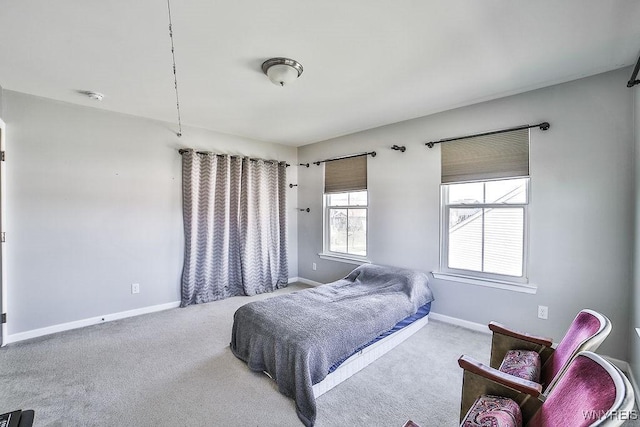 bedroom featuring carpet floors and baseboards