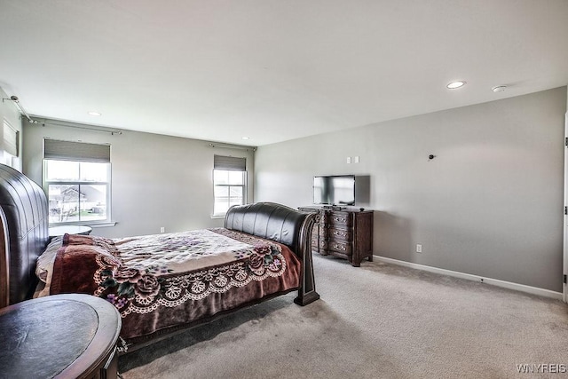 carpeted bedroom featuring recessed lighting and baseboards