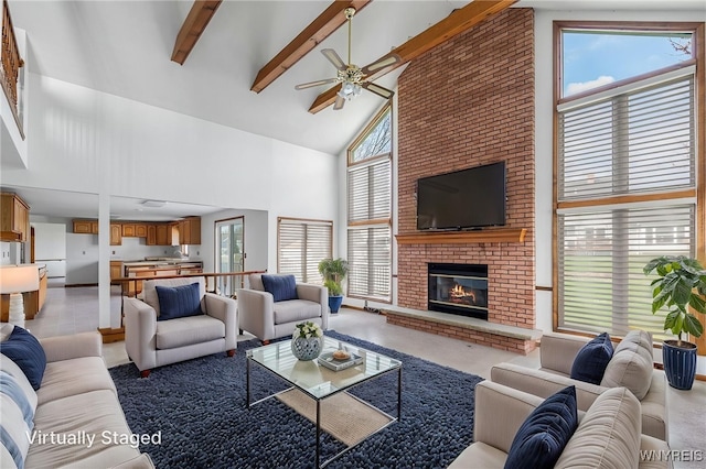 living room with a brick fireplace, high vaulted ceiling, ceiling fan, and a wealth of natural light