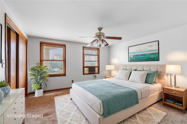 bedroom with cooling unit, a ceiling fan, light carpet, and baseboards
