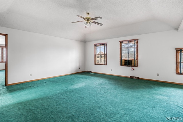unfurnished room with baseboards, ceiling fan, a wealth of natural light, and carpet flooring