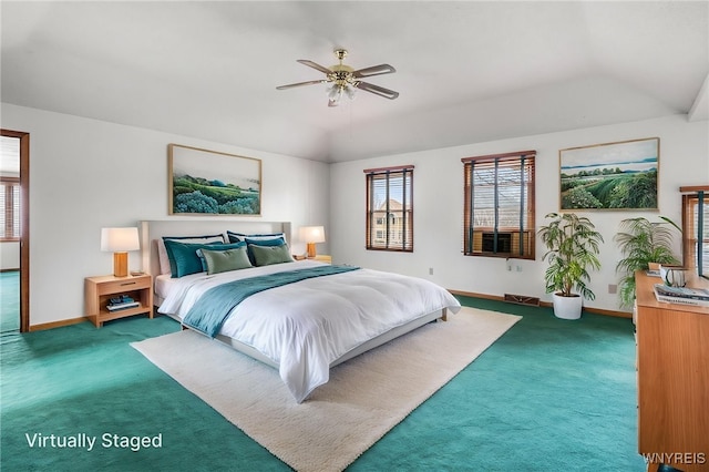 carpeted bedroom with multiple windows, vaulted ceiling, and baseboards