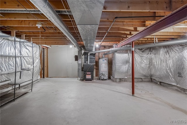 unfinished basement featuring gas water heater and heating unit